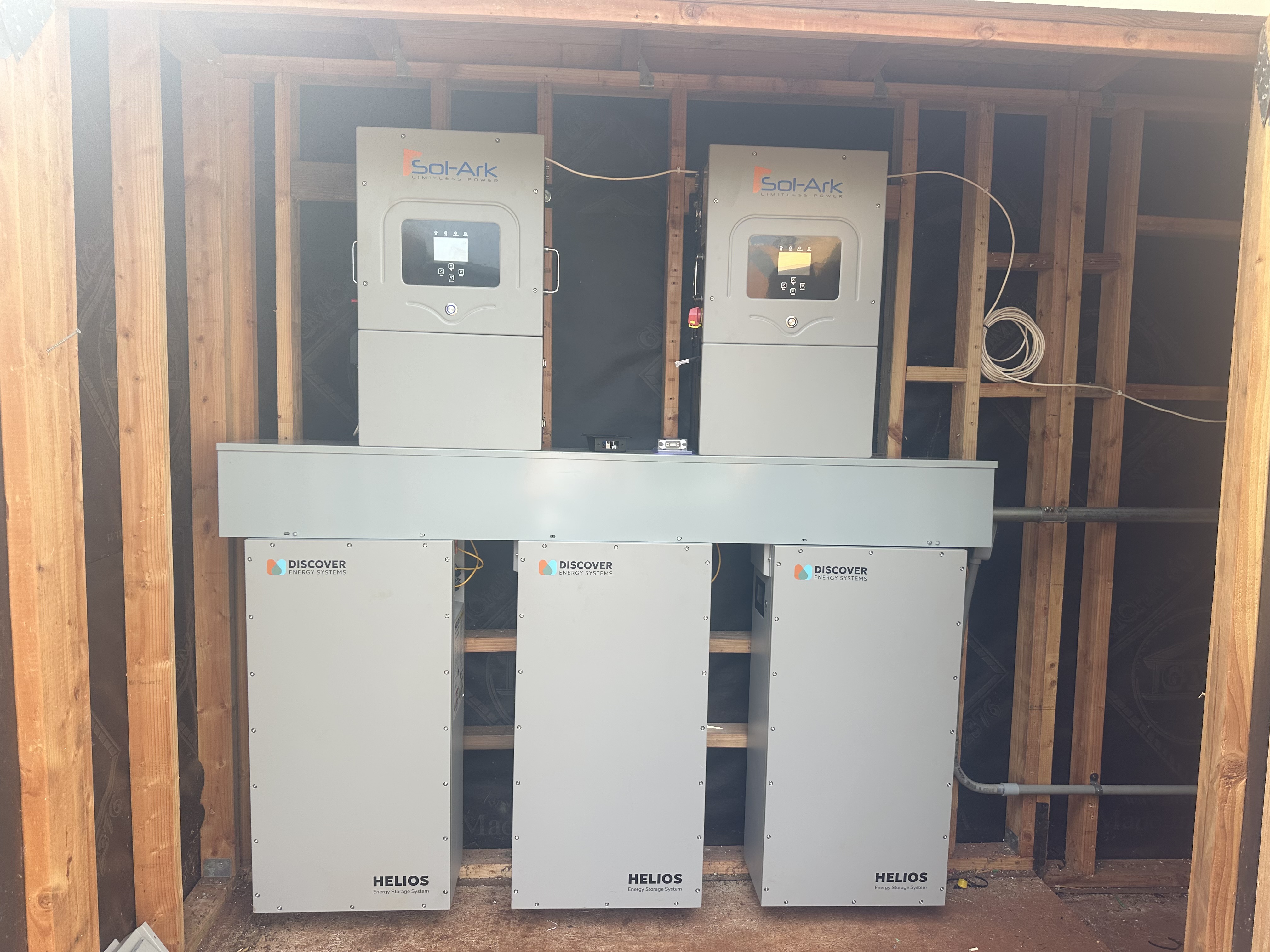 Renewable Enterprises installation with two Sol-Ark inverters and three Discover Helios batteries